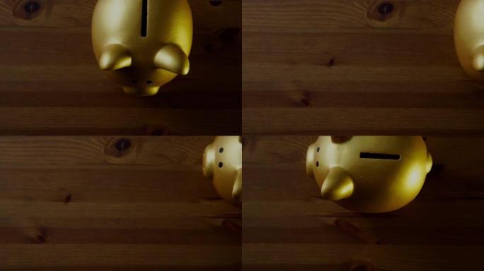 木制桌面上金色存钱罐的俯视图