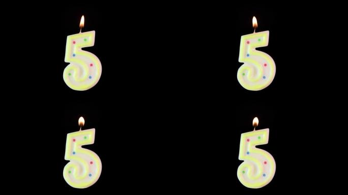 5号蜡烛燃烧-生日!黑色背景。