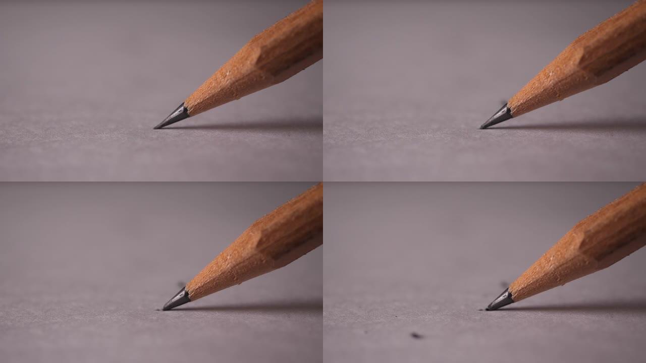 书写时铅笔折断的微距镜头的慢动作
