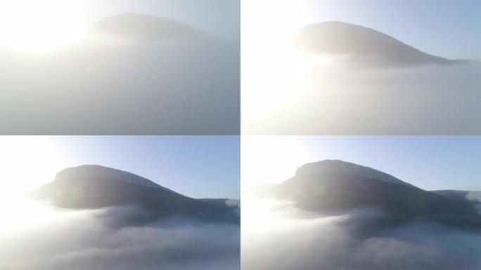 秋天的鸟瞰图。自然和云景。周围的雾和雾在景观中创造了简单。