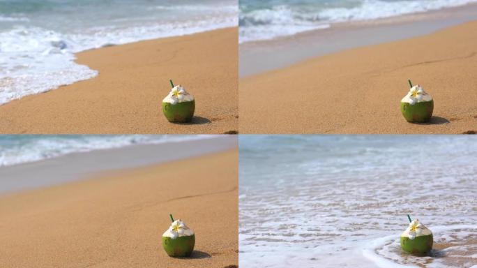 沙滩上的新鲜椰子背景，吸管可供饮用。