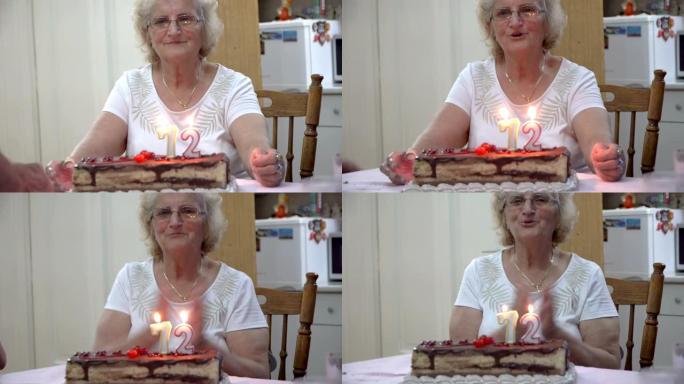 快乐的祖母正在家里庆祝她的72岁生日