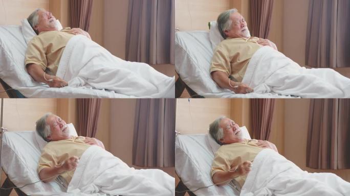 有心脏病的高龄患者躺在床上康复室有反复发作的疾病，胸闷，按下紧急按钮，打电话给医生和护士。医学、保健