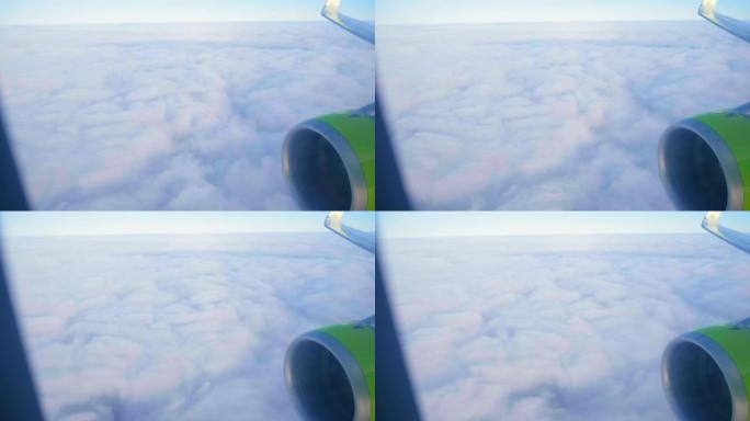 喷气式客机在蓝天下飞过白色密云