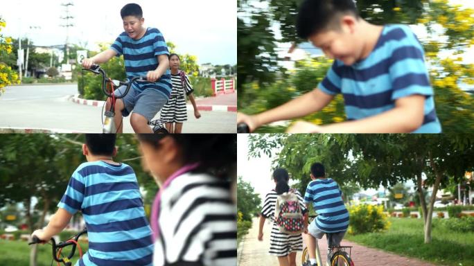 亚洲孩子骑自行车，晚上一起玩乐，生活方式理念。