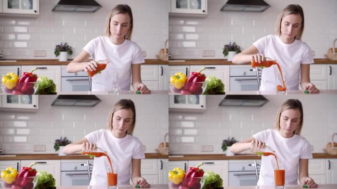 女人pours carrot juice into a glass