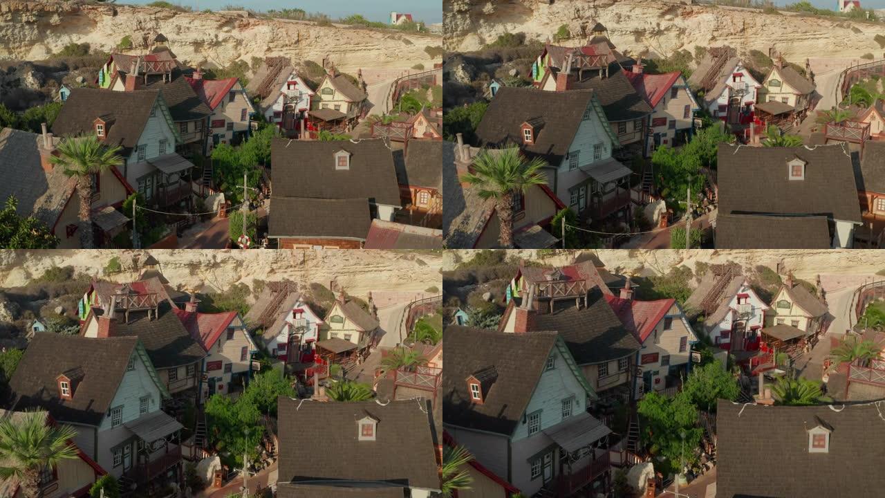 Popeye Village电影电影中的彩色房屋设置在马耳他戈佐岛，空中无人机透视多莉向前倾斜