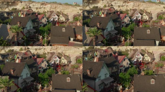 Popeye Village电影电影中的彩色房屋设置在马耳他戈佐岛，空中无人机透视多莉向前倾斜