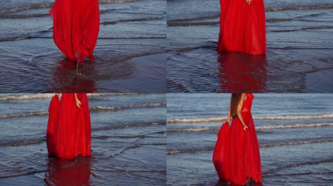 长发黑发女人站在海水中拿着连衣裙下摆