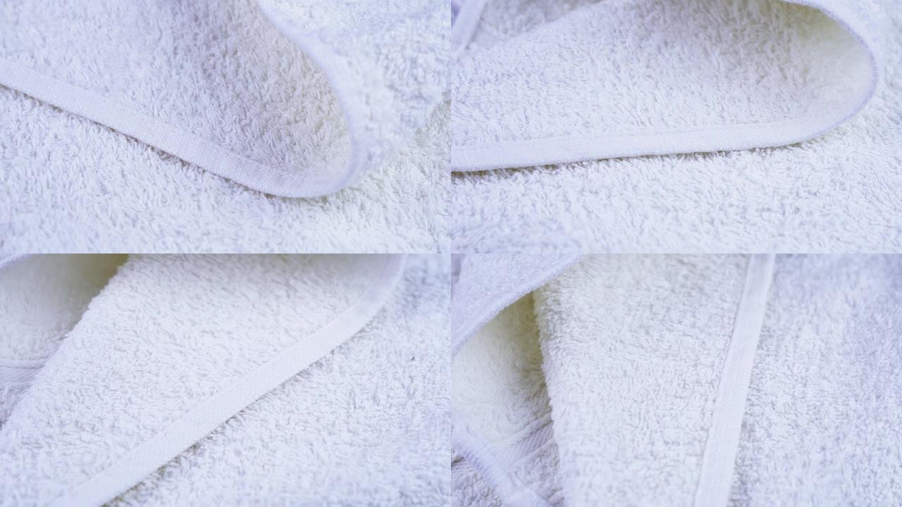 白色毛圈浴室毛巾躺着旋转