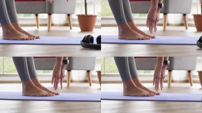 特写亚洲女性在家锻炼大脚趾瑜伽姿势