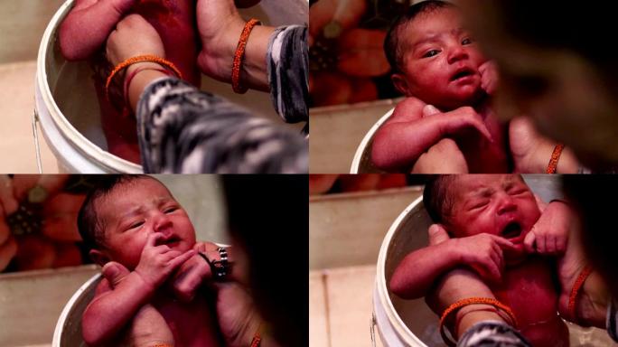无辜的新生婴儿第一次洗澡
