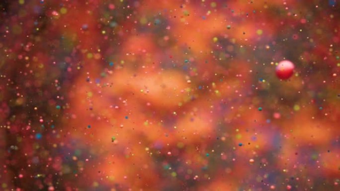 彩色气泡油美丽的油漆宇宙颜色移动五彩。假日背景。圣诞节。星系星云太空恒星行星。银河系。具有混沌运动液