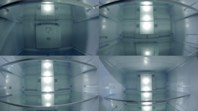 特写沿着现代空的开放式冰箱移动