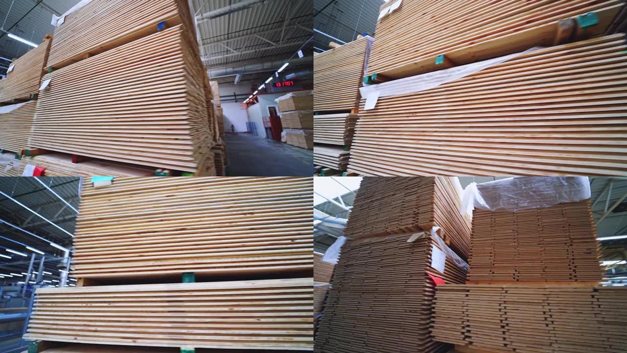 车间里成堆的层压地板。生产拼花板的工厂。现代工业木工厂。