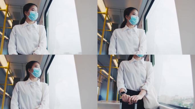 在泰国冠状病毒大流行期间，亚洲女商人乘客在前往机场的火车上戴着外科口罩。