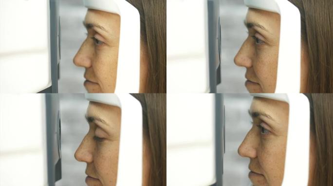 折光仪测试过程中女人的特写肖像。