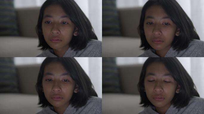 亚洲小女孩哭泣和流泪的特写。亚洲女孩有悲伤的情绪和面部表情