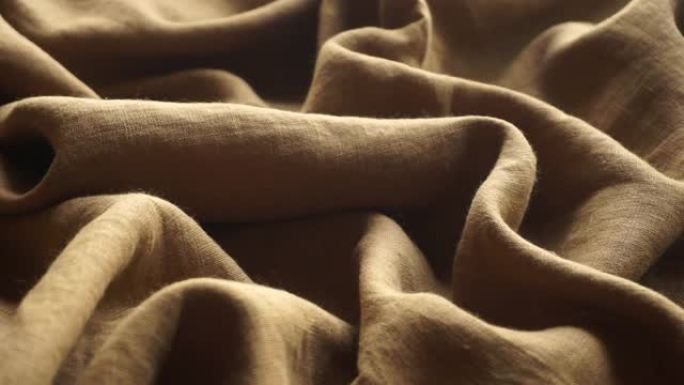 亚麻织物背景。织物质地和图案的亚麻纺织布。生产服装和天然环保材料。