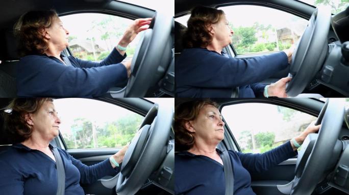 休闲的老年妇女开车手握方向盘转弯