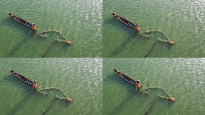 在宋卡湖的一艘渔船上空飞行