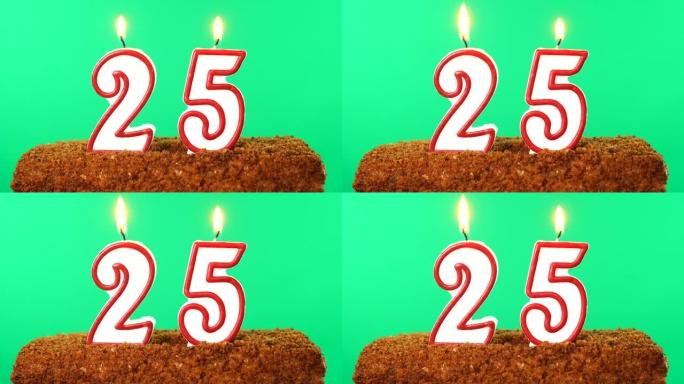 用25号点燃蜡烛的蛋糕。色度键。绿屏。隔离
