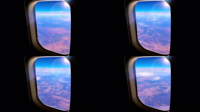 从高空飞行的商用飞机上的乘客窗口看