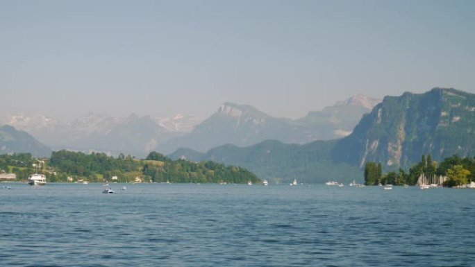 卢塞恩市晴天湖滨湾山景观慢动作全景4k瑞士
