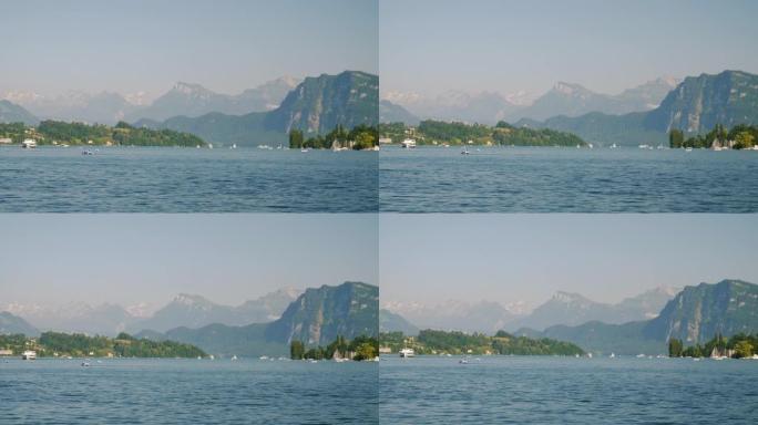 卢塞恩市晴天湖滨湾山景观慢动作全景4k瑞士