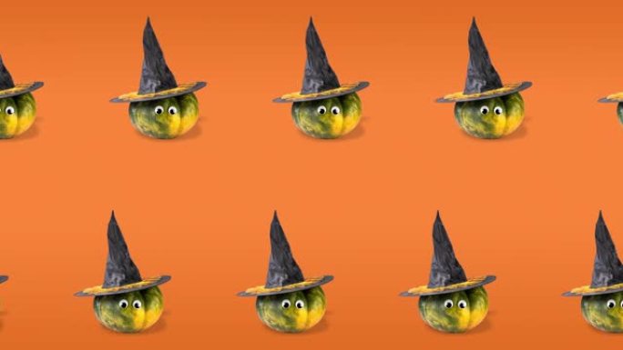 无缝模式动画，有两排南瓜，有谷歌般的眼睛和女巫帽。万圣节概念，橙色背景上有复制空间