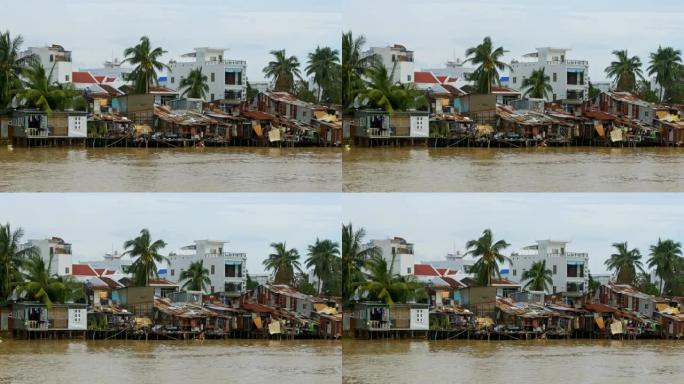 位于河岸的贫困房屋在台风后受到破坏