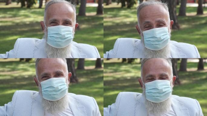 戴着医用面具的英俊老人微笑着。一个人