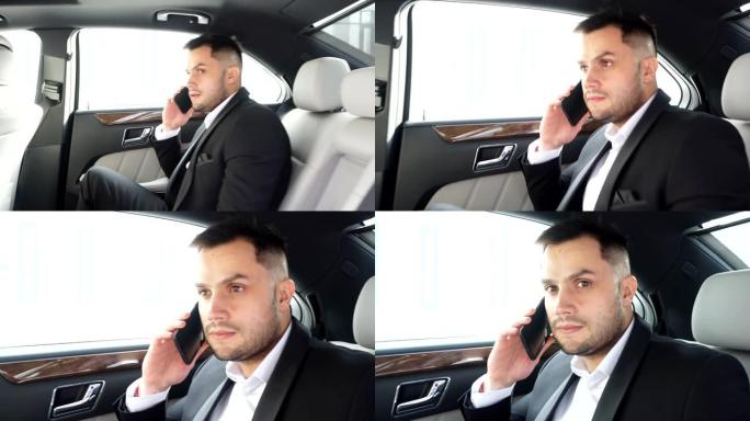 忙碌的优雅男性坐在车内打电话