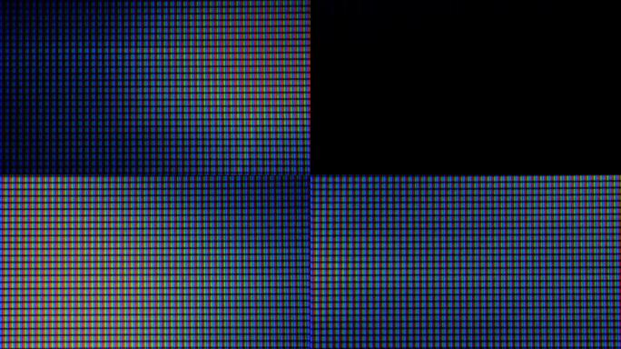LCD屏幕像素。电脑屏幕的微距拍摄，像素纹理。抽象的蓝色背景。采用彩色阴影技术的近距离发光二极管显示