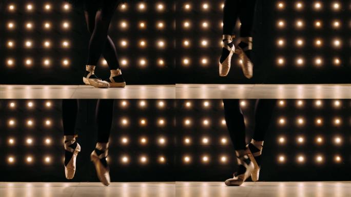 穿着足尖鞋的芭蕾舞女演员的脚在黑暗的工作室里跳芭蕾舞。