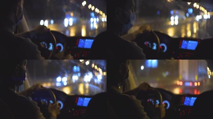 戴着医用口罩的年轻人开车穿过夜城路