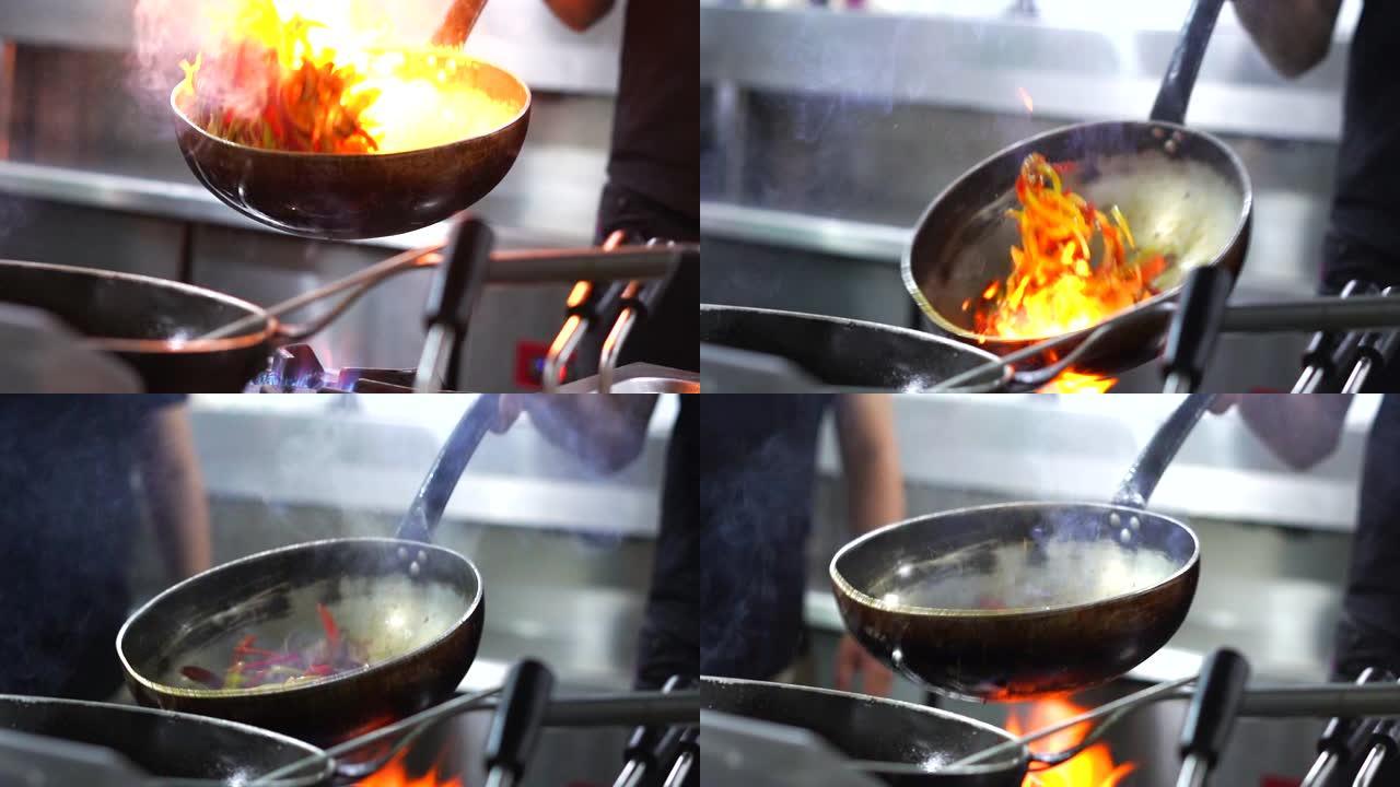 用火焰在炒锅里飞行的蔬菜