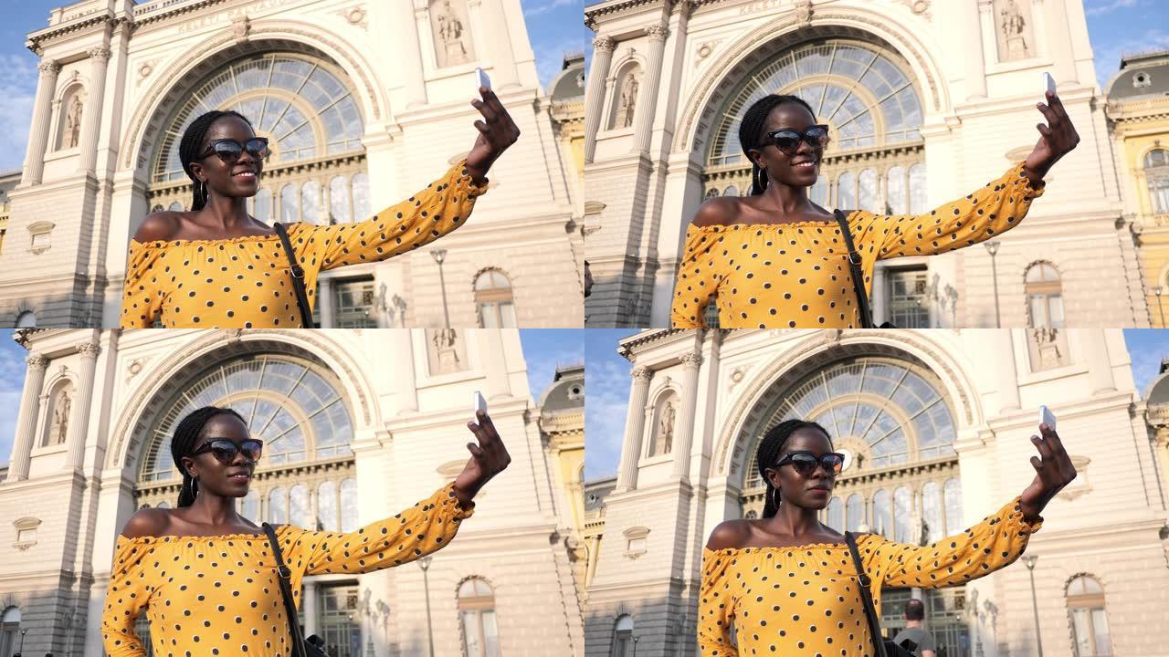 千禧一代非洲游客的肖像，编发自拍 -- 手持相机