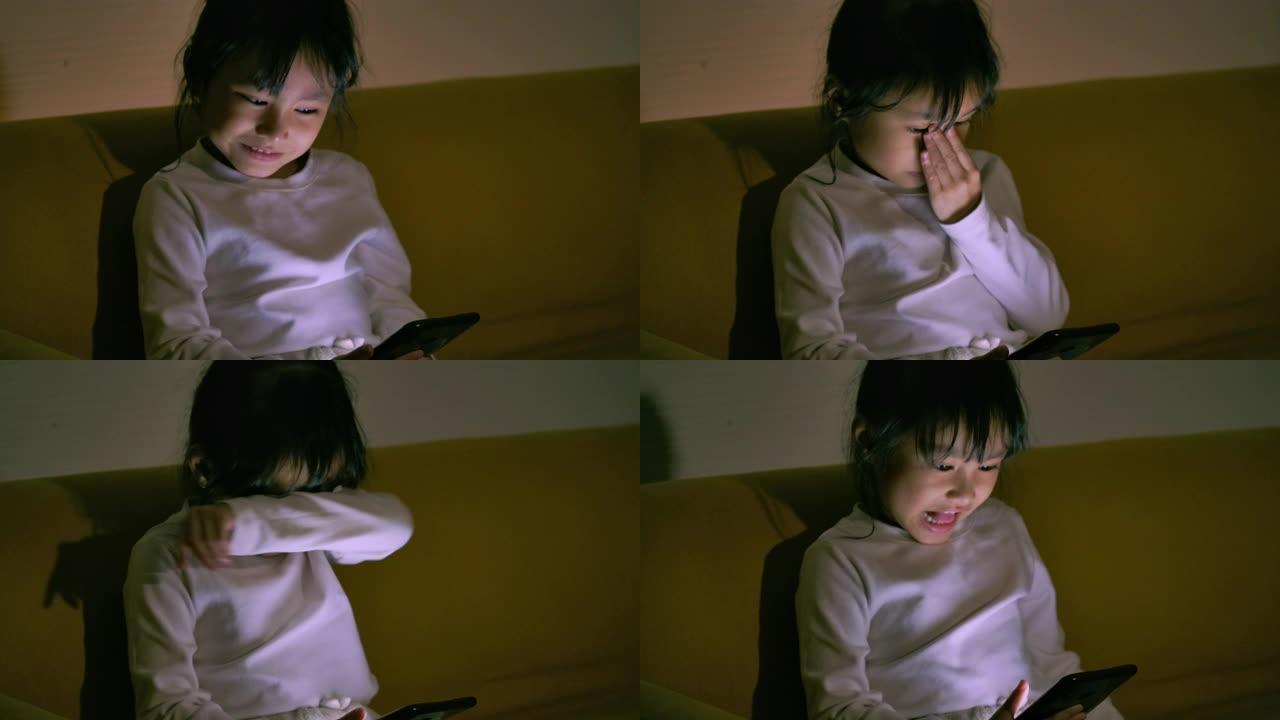 小女孩在看手机，玩手机。