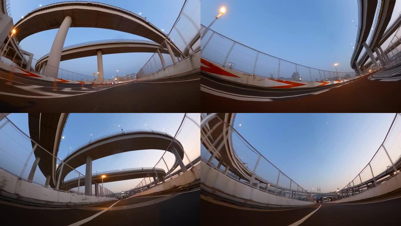 黄昏在高速公路上行驶/POV在环路桥上拍摄。