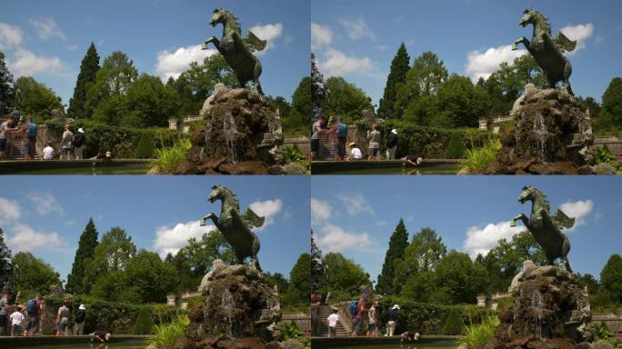萨尔茨堡市晴天著名旅游拥挤花园喷泉慢动作全景4k奥地利