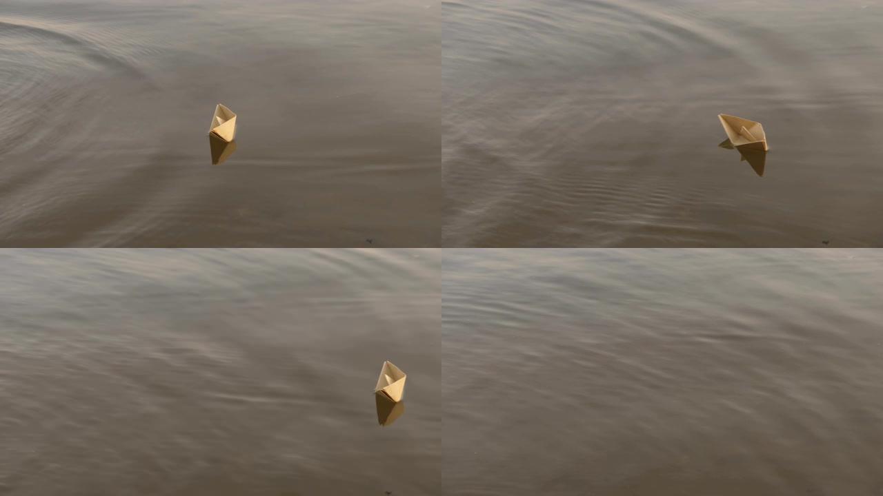 纸船漂浮在河上。纸折纸。