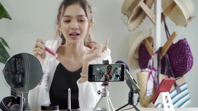 美容博主女人在相机上拍摄日常化妆常规教程。