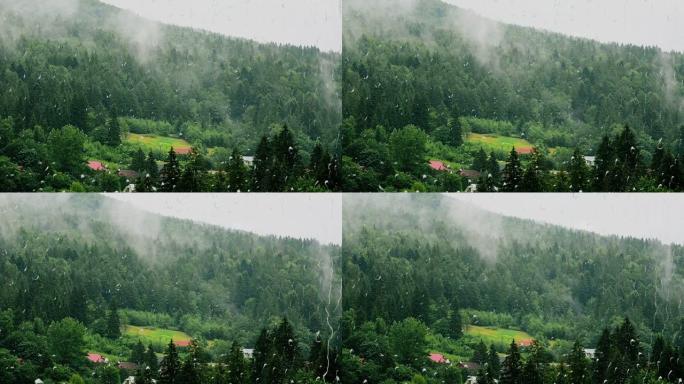 雨和山。从窗户看。