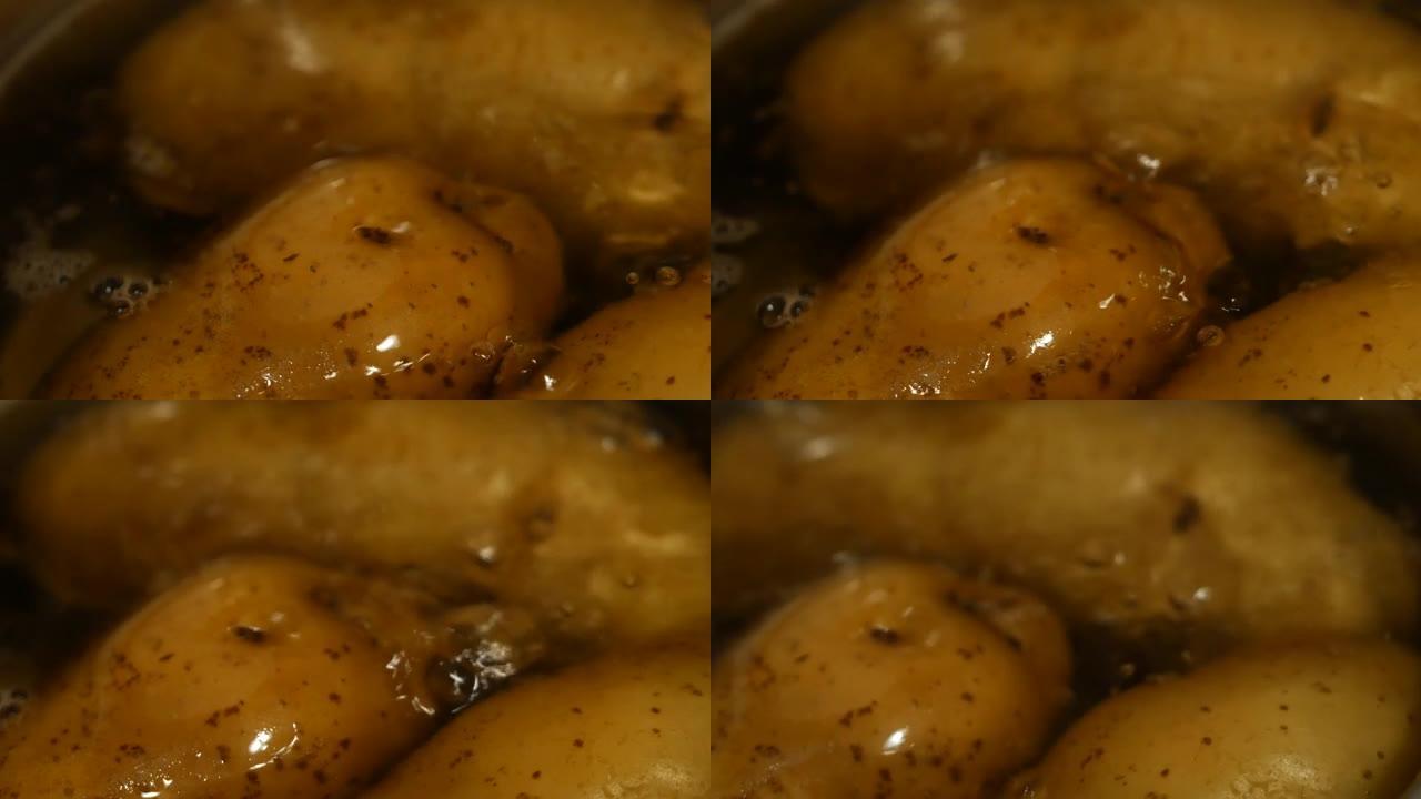 马铃薯块茎在水中煮沸。薄皮生新鲜去皮土豆