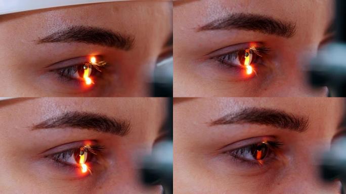 一名年轻女子用一盏特殊的大验光机 -- 棕色眼睛颜色来检查她的视力