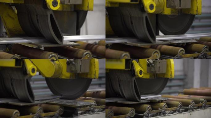 在制造中使用机器人圆锯切割铝型材的关闭。铝门窗制造。