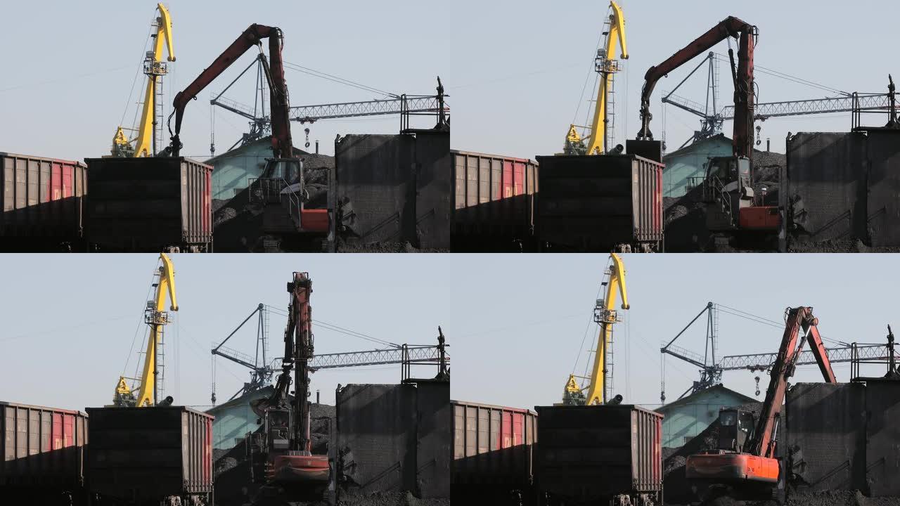 海运煤炭码头。装卸起重机使用大桶从铁路货车上卸下煤炭。