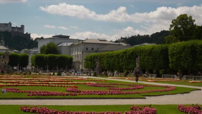 萨尔茨堡市晴天著名旅游拥挤花园城堡景观慢动作全景4k奥地利