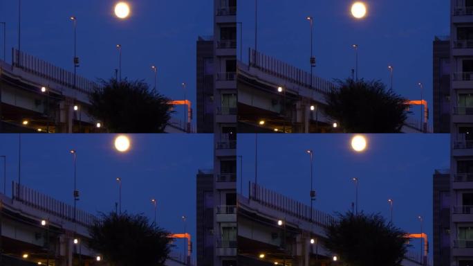 在公路桥梁上方升起月亮